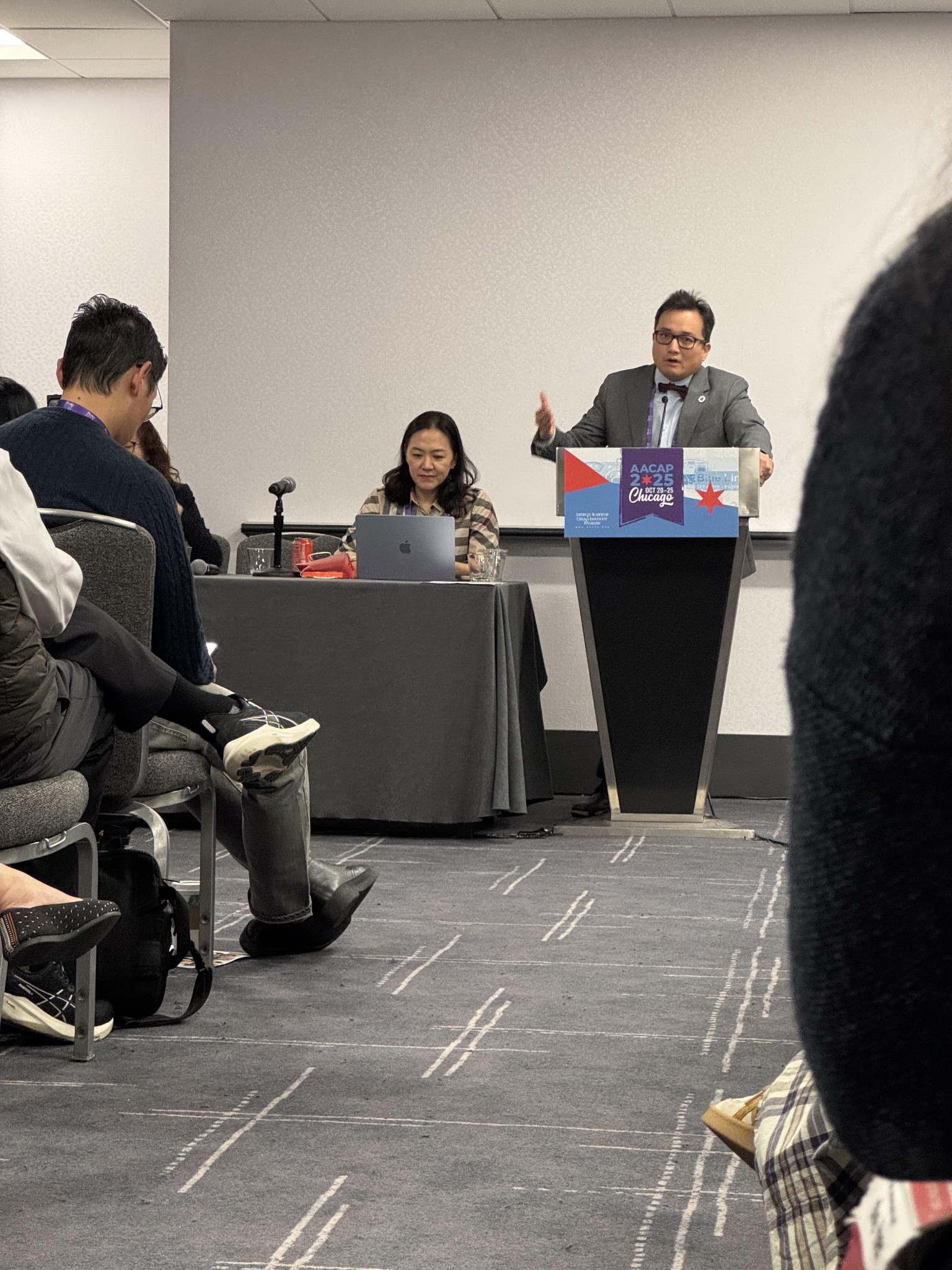 Richard Ha speaking at an AACAP meeting